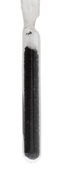 A glass tube hold a material that look like small black pellets