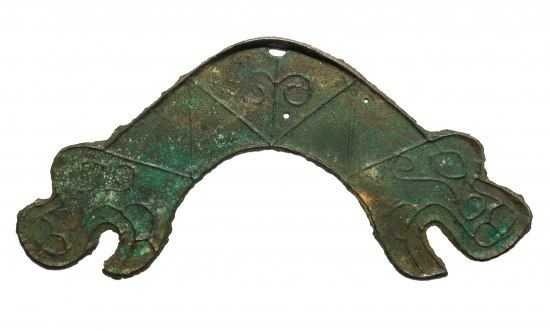 A greenish piece of arched metal with a creature's head at either end
