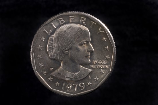 A silver coin with a woman's likeness on the front. Reads "Liberty" at the top and "1979"