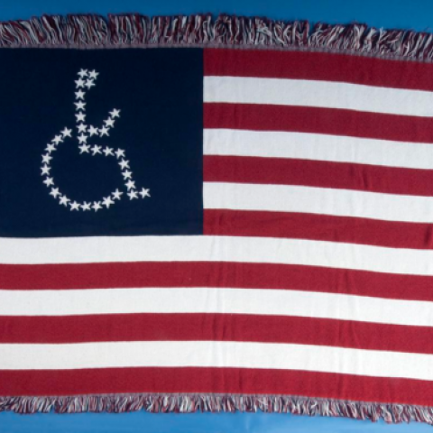 Woven American flag with person in wheelchair symbol instead of stars
